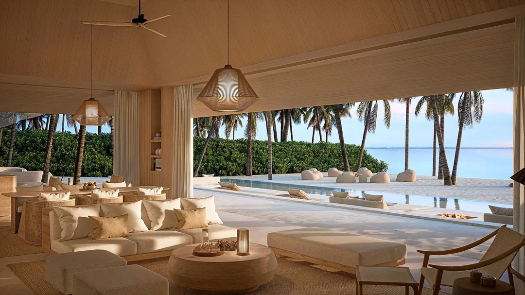 Architectural rendering of an Aman Maldives beach pavilion overlooking a pool, palm trees and the sea