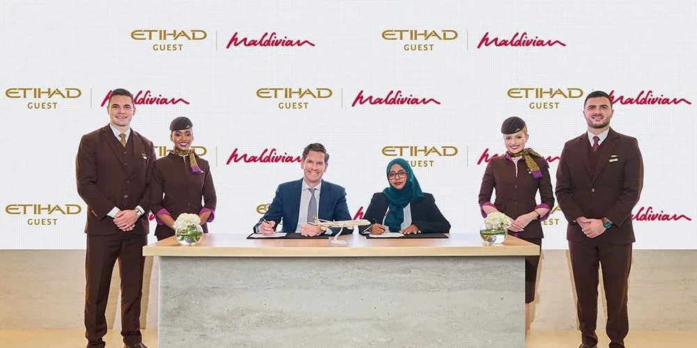Etihad Guest and Maldivian representatives at the partnership signing, pictured in the September 2026 press announcement.